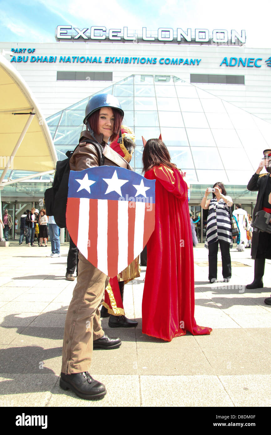 London, UK. 26th May, 2013. Thousands of people attended the MCM London Comic con on Sunday 26th May. Pictured:A female Comic fan in an original Captain America costume posess for photos at the Excel London. Credit David Mbiyu/Alamy Live News Stock Photo