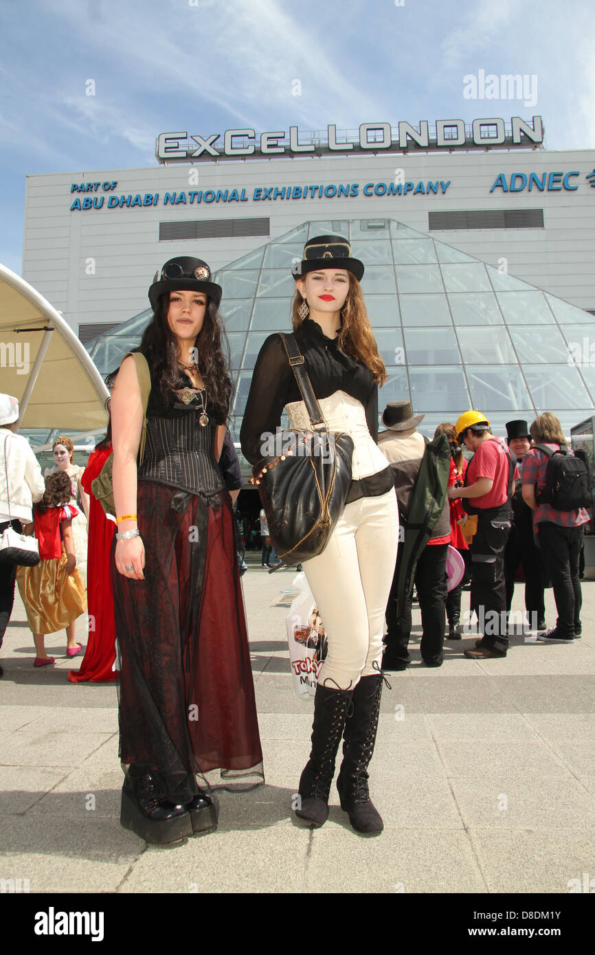 London, UK. 26th May, 2013. Thousands of people attended the MCM London Comic con on Sunday 26th May. Pictured:Two Comic fans dressed in Steampunk costume poses for photos at the Excel London. Credit David Mbiyu/Alamy Live News Stock Photo