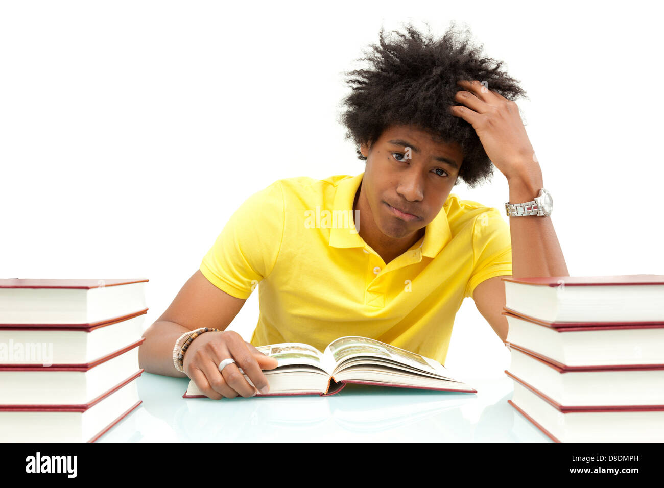 Young african american student reading books, over white background - African people Stock Photo