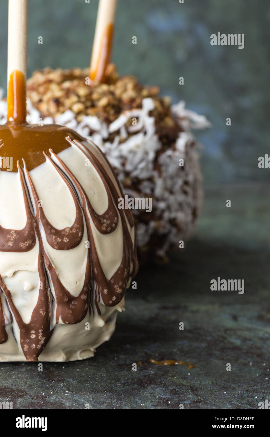 Sweet chocolate or caramel covered apples with nuts Stock Photo