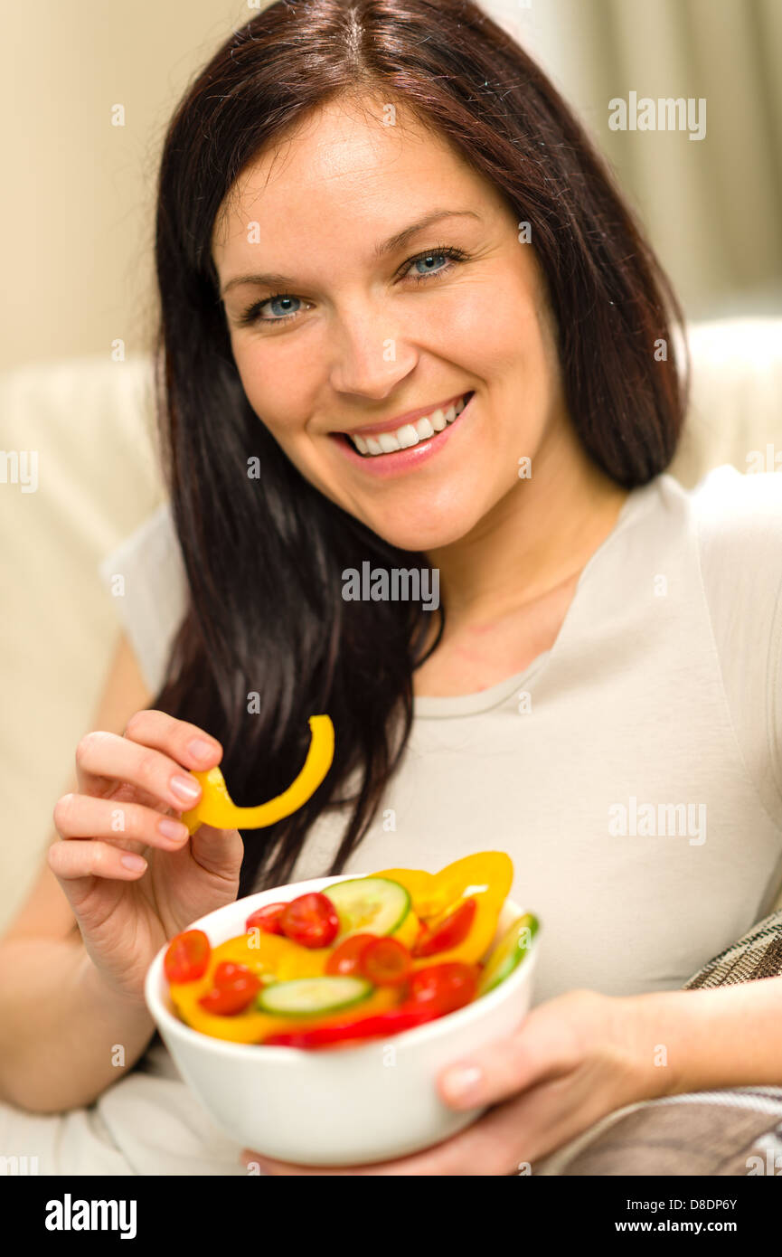 Portrait of woman eating healthy salad Stock Photo