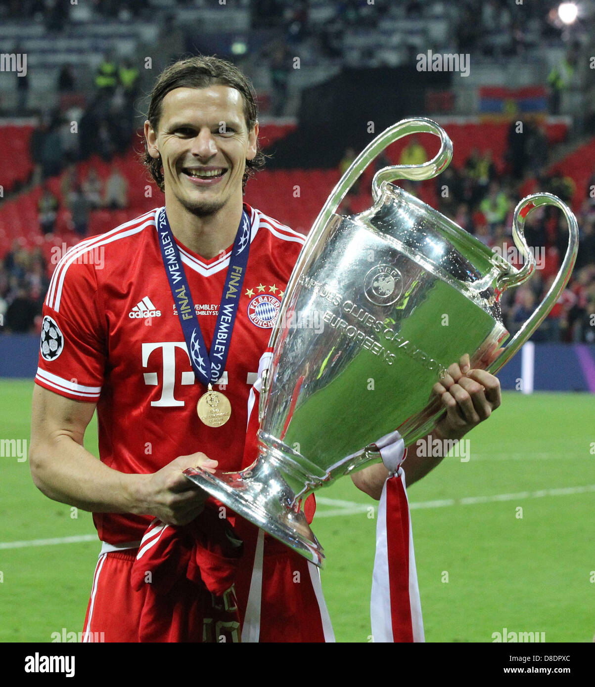 London, UK. 25th May, 2013. Daniel Van Buyten of Bayern Munich with Trophy  after the Champions League Final between Bayern Munich and Borussia  Dortmund from Wembley Stadium. Credit: Action Plus Sports Images/Alamy