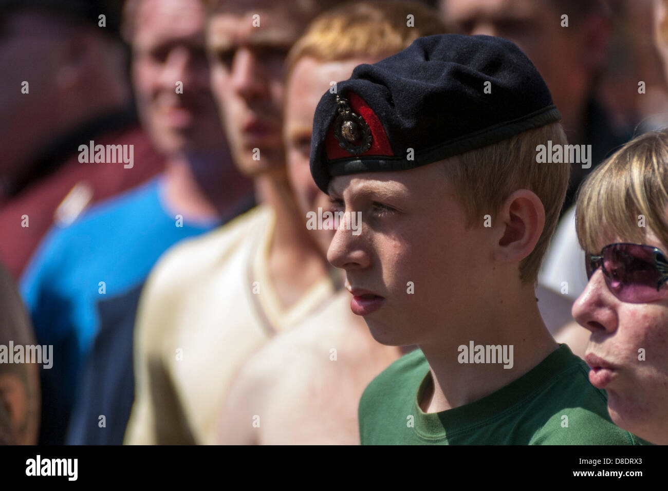 Woolwich, London, UK. 26th May, 2013. A young man in a military beret marches with thousands of English Defence League supporters as they head towards the site in Woolwich where Drummer Lee Rigby was murdered. Credit: Paul Davey/Alamy Live News Stock Photo