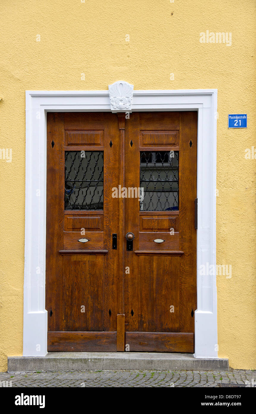 Old classy two-winged oaken front door. Stock Photo