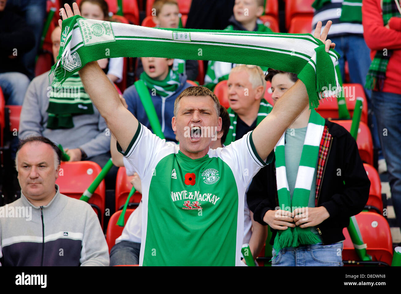 Glasgow, Scotland, UK. Sunday 26th May 2013. A Hibs fan tries to encourage his team during the Hibs v Celtic William Hill Scottish Cup Final at Hampden Park Stadium. Credit: Colin Lunn / Alamy Live News Stock Photo