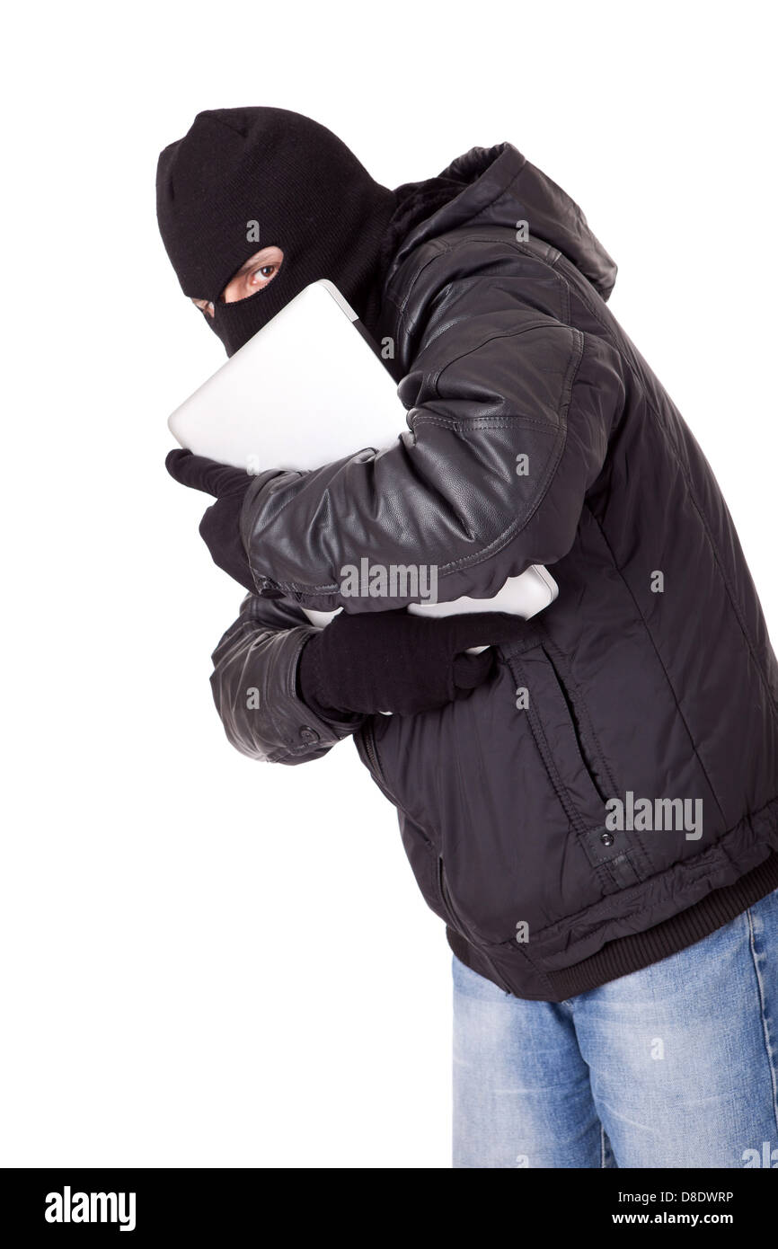 Thief holding a white laptop Stock Photo - Alamy
