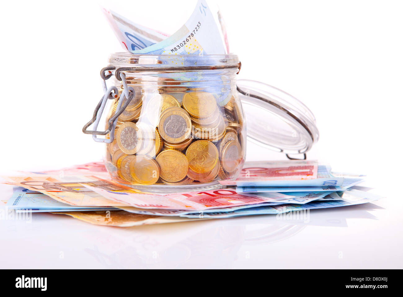 Money jar, isolated over white background Stock Photo - Alamy