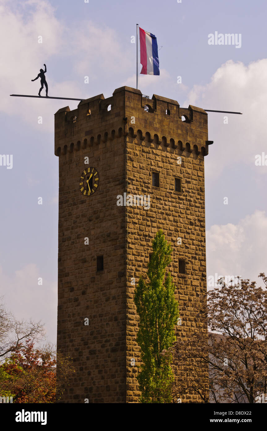 Medieval tower Götzenturm with sculpture 'Über dem Abgrund'. Artist: Hubertus von der Goltz - Heilbronn, Germany Stock Photo