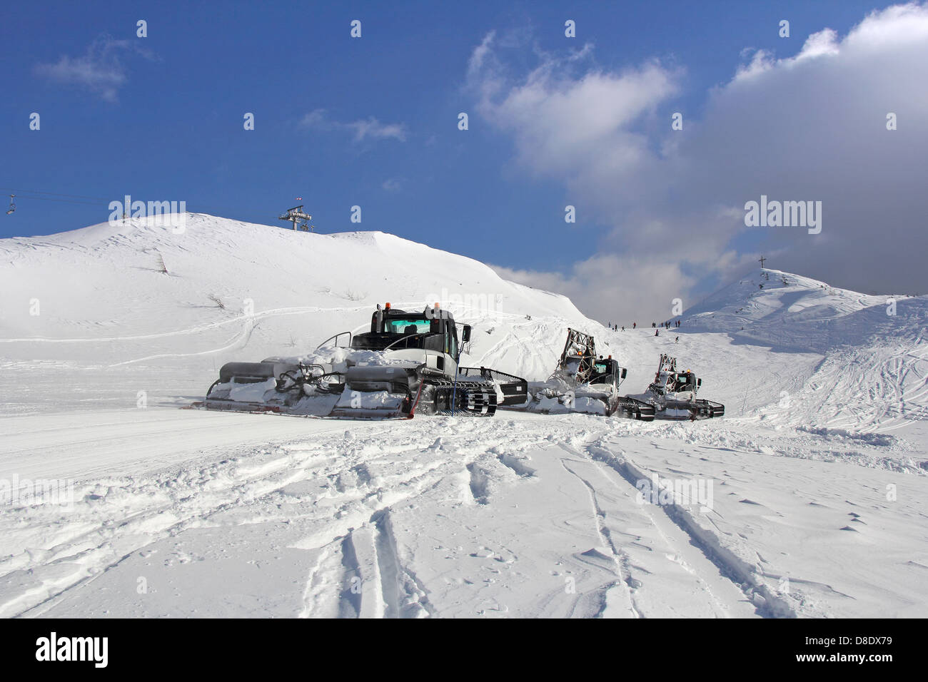 Snow groomers on a skiing slope, Vogel in Slovenia Stock Photo