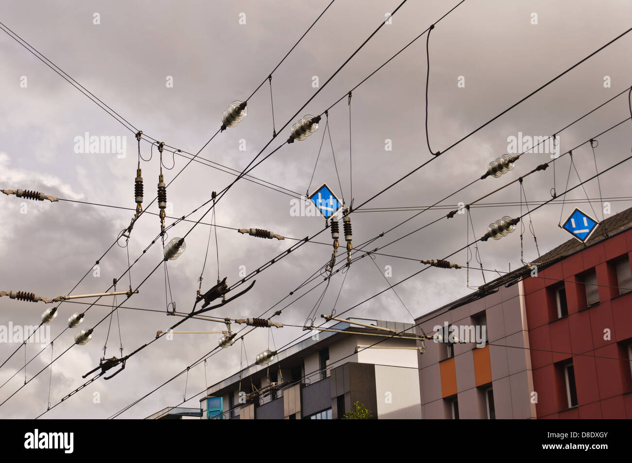 Catenary, contact wires, against thunderstorm and rain clouds Stock Photo