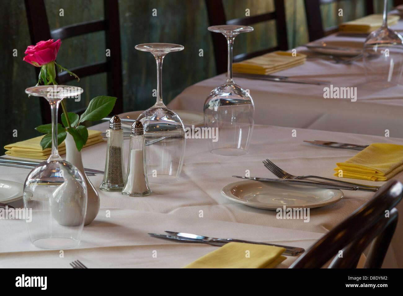 A line of newly made restaurant tables Stock Photo