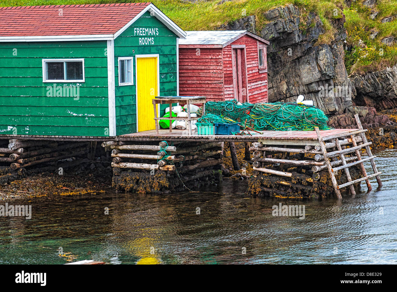 Fishing Shacks and Commercial Fishing Nets in Champney's West Newfoundland Stock Photo