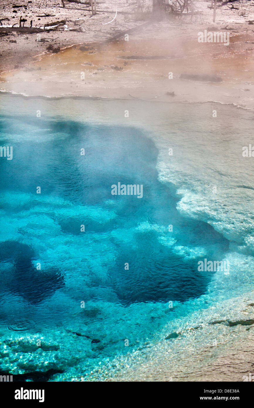 Clear aquamarine geothermal spring along Fountain Paint Pot trail at Lower Geyser Basin in Yellowstone National Park Stock Photo