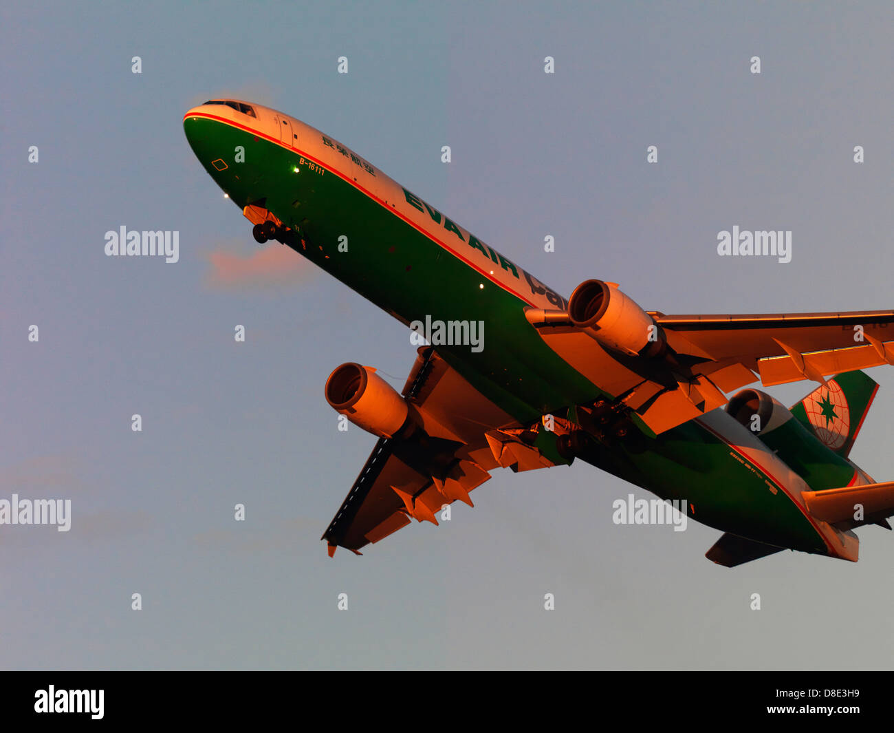 Eva Air Cargo MD-11 flying into the sunset Stock Photo