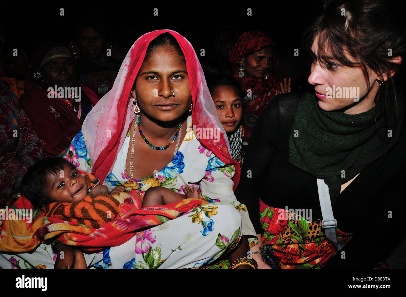 Indian woman holding baby hi-res stock photography and images - Alamy