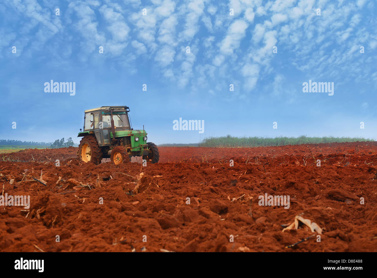 tractor cultivatin soil ready for seeding in spring Stock Photo