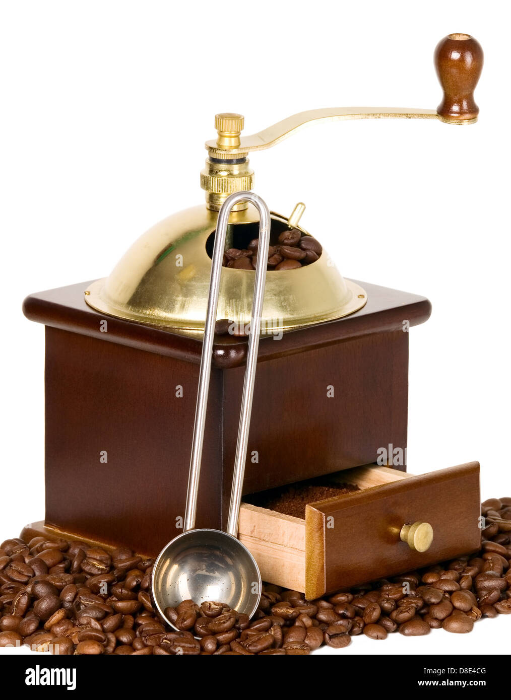 Coffee grinder in wooden case with golden top Stock Photo