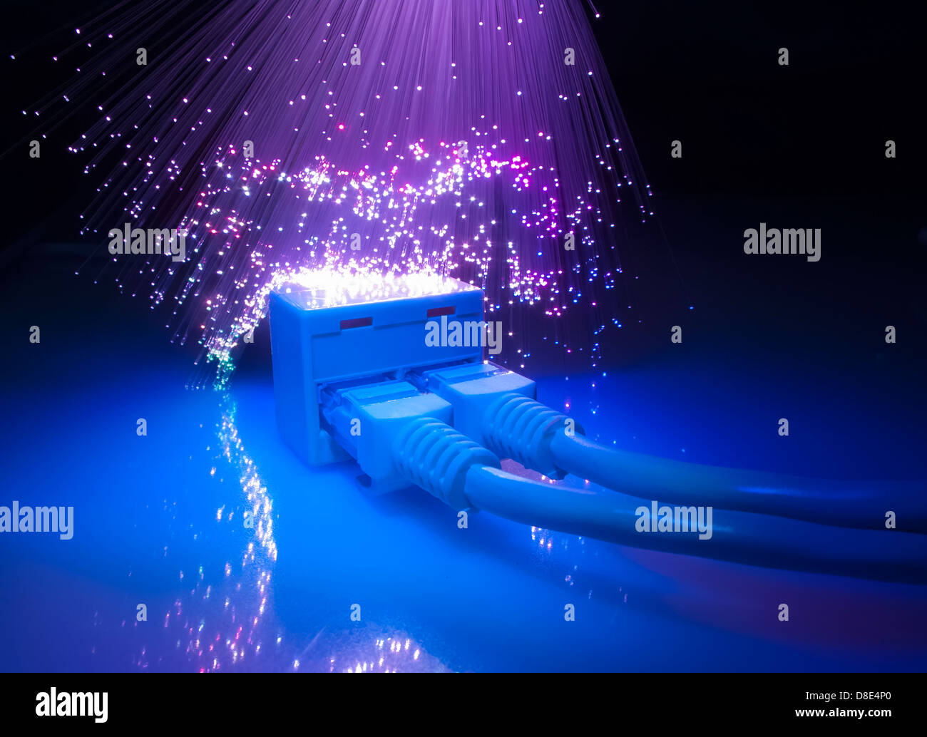 network cables and hub closeup with fiber optical background Stock