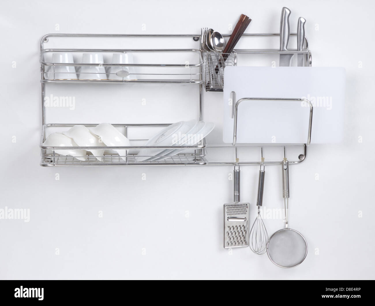 Stainless shelf with kitchen utensil on the white background Stock Photo