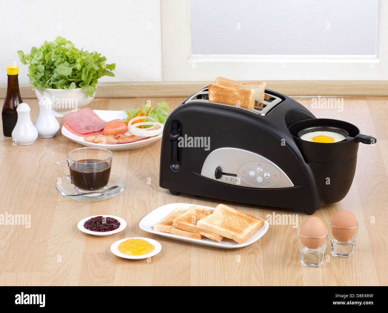 Multi purpose bread toaster, it has function for boiling and frying egg also Stock Photo