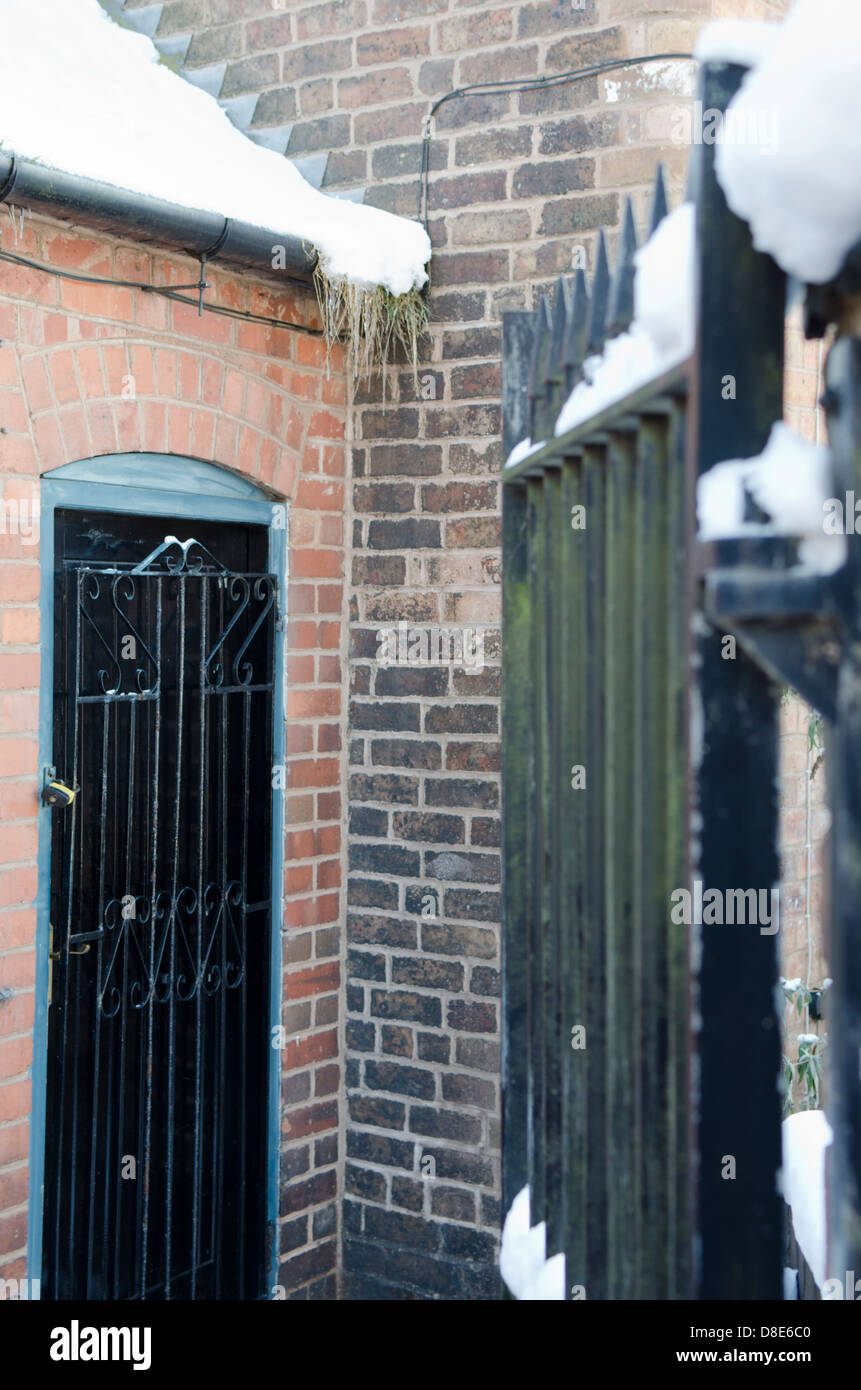 Open gate leading to a locked gate Stock Photo Alamy
