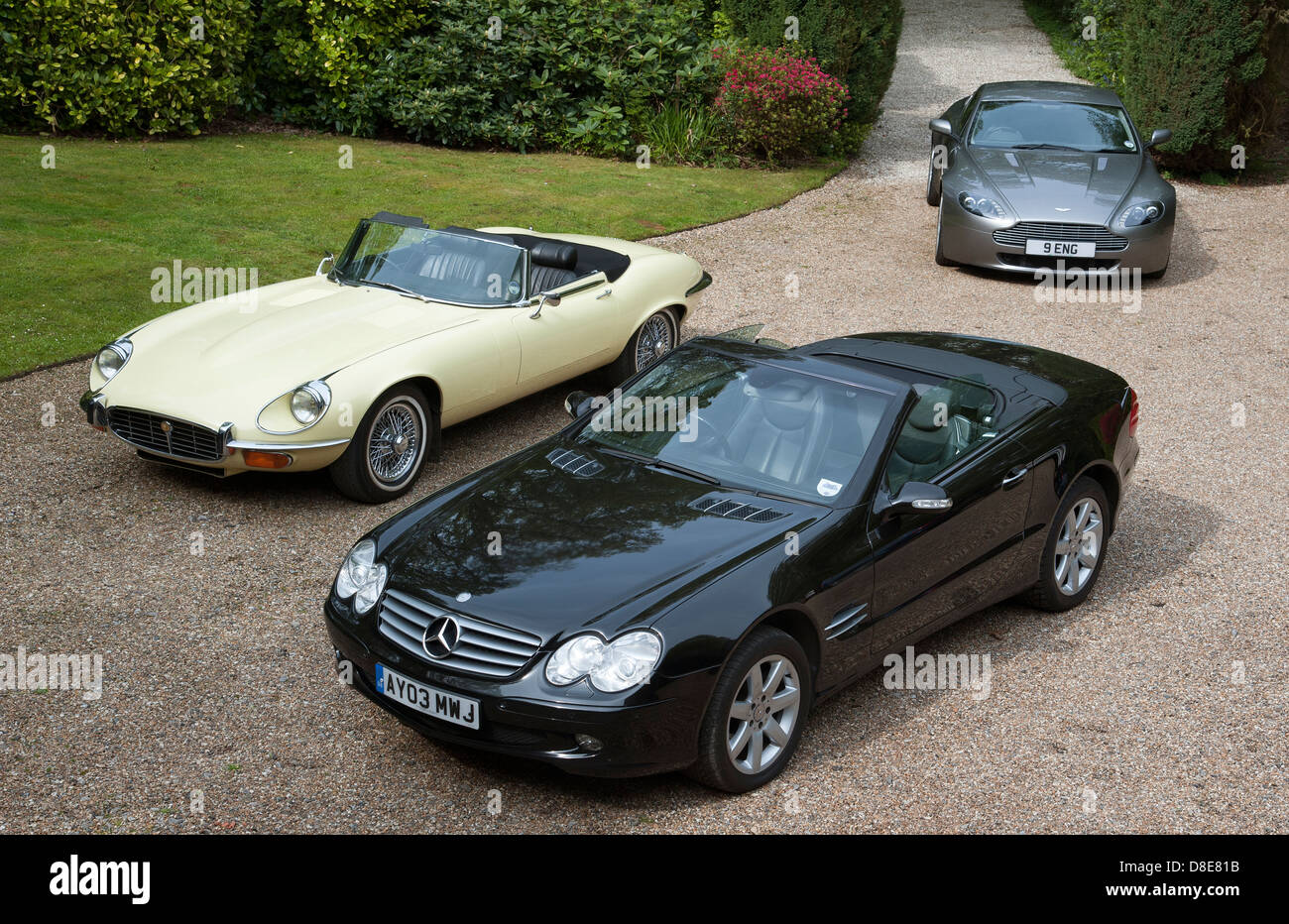 Expensive luxury cars on a driveway Stock Photo