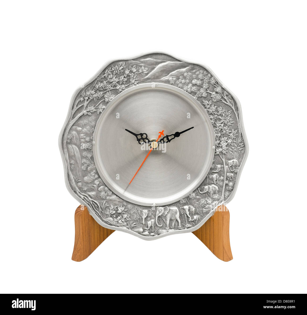 Beautiful plate clock made of pewter on wood stand Stock Photo