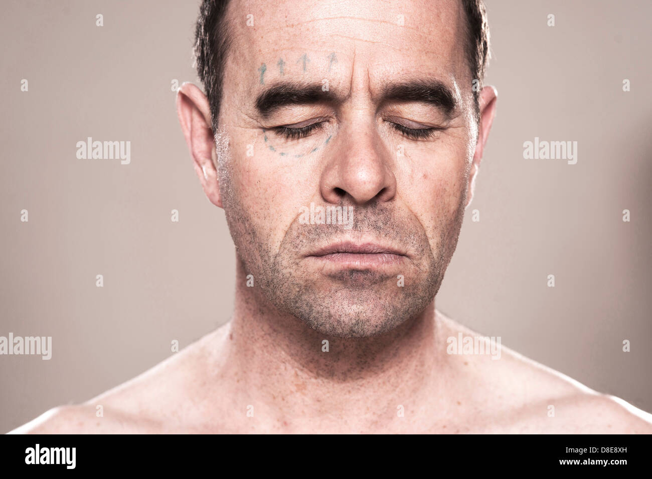 Serious man with closed eyes, close-up Stock Photo