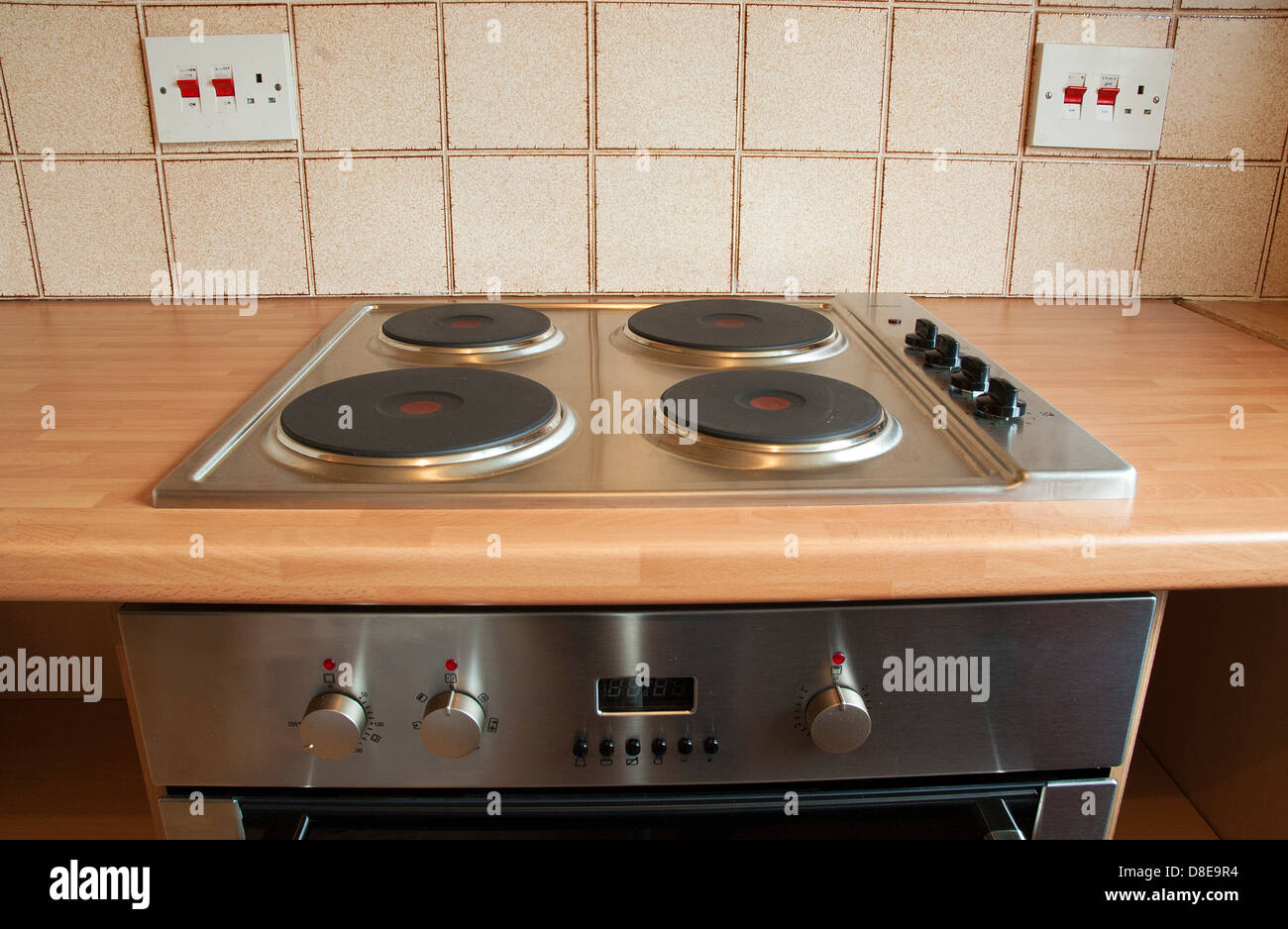A new electric hob and cooker just fitted in a new kitchen Stock