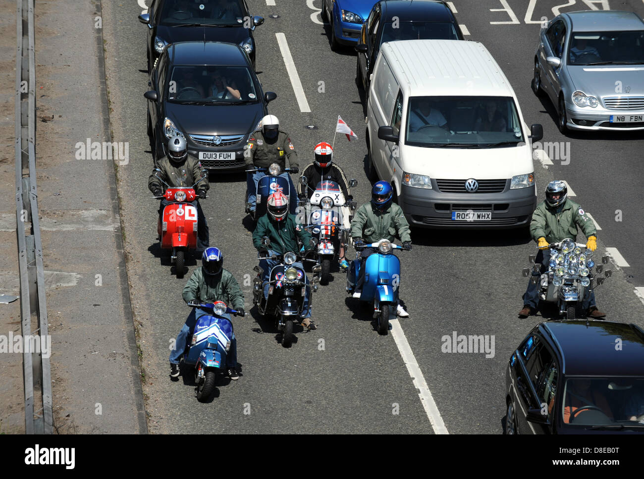 A group of mods on their scooters stuck in a traffic jam heading into Brighton on the A23  for Bank Holiday Monday Stock Photo