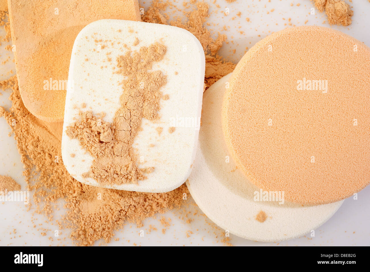 powder and cosmetic sponges on white background Stock Photo - Alamy