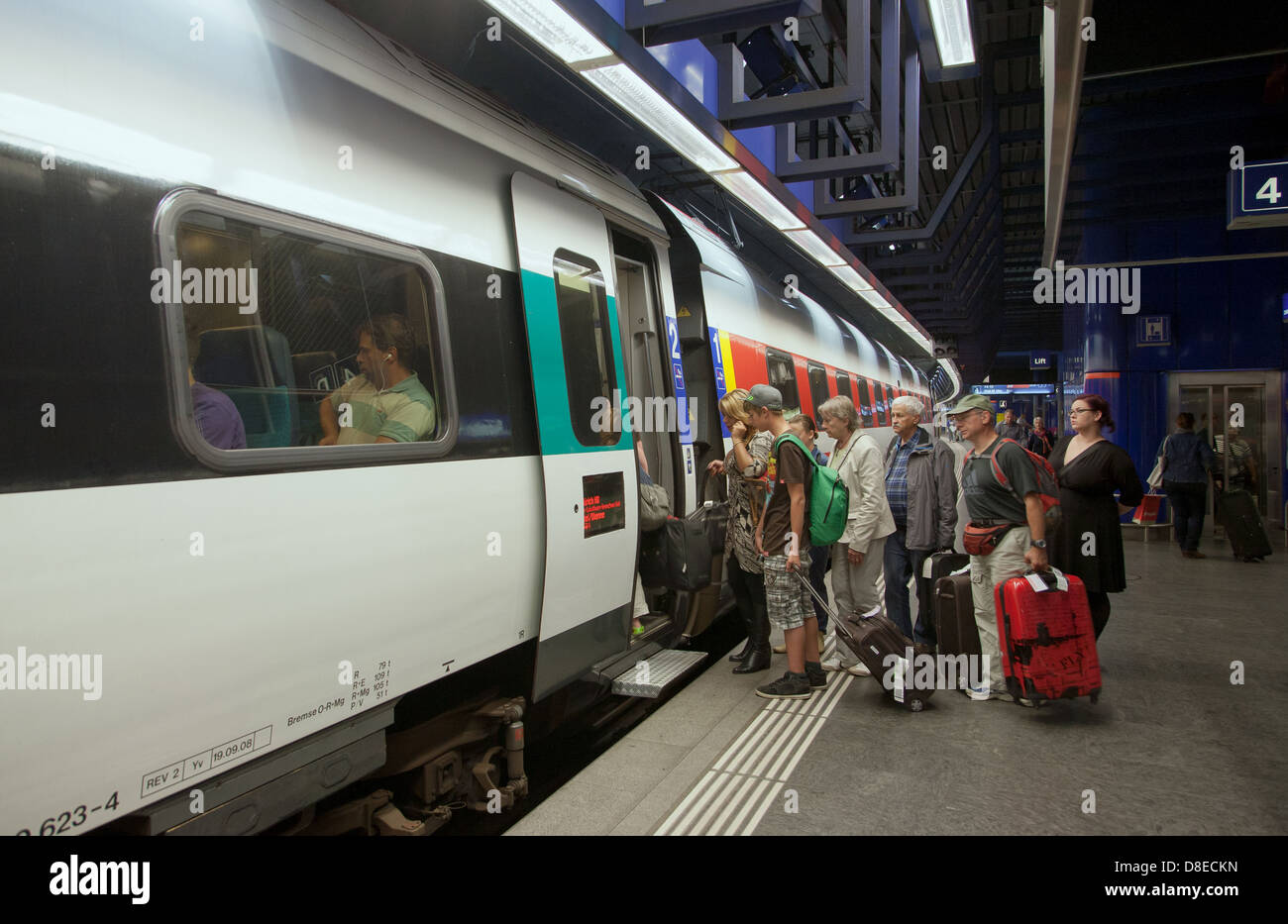 Zurich, Switzerland, passengers at Zurich airport train station get on a train of the SBB Stock