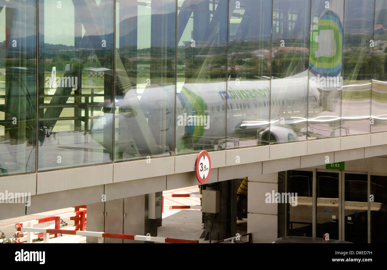 Transavia Plane mirrowed in windows on Airport of Malaga, Andalusia, Spain. Stock Photo