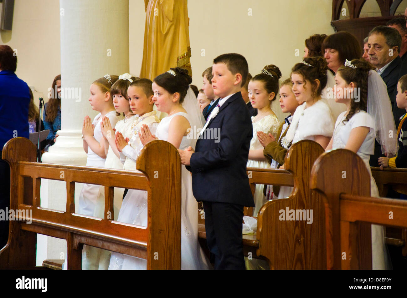 Children at a First Communion Mass Stock Photo - Alamy