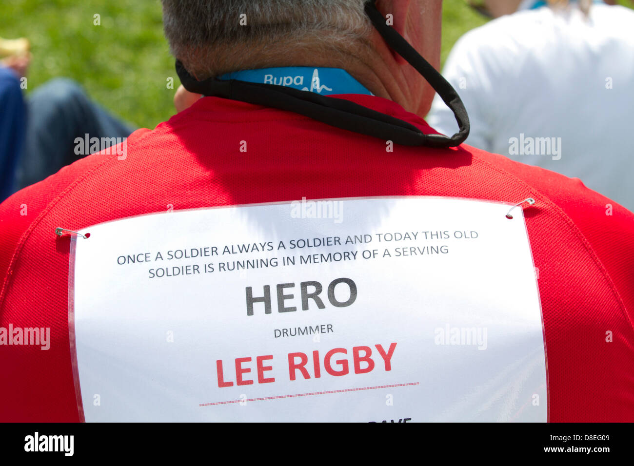 27th May 2013. London UK A soldier running in memory of drummer Lee Rigby who was murdered in Woolwich. Thousands of runners take part in the annual BUPA 10,000 road race through the streets of London with many runners running for various charities Stock Photo