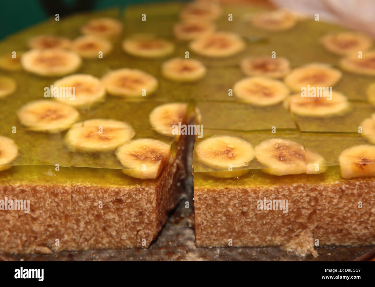 Fruit jelly cake with slices of banana as background Stock Photo Alamy