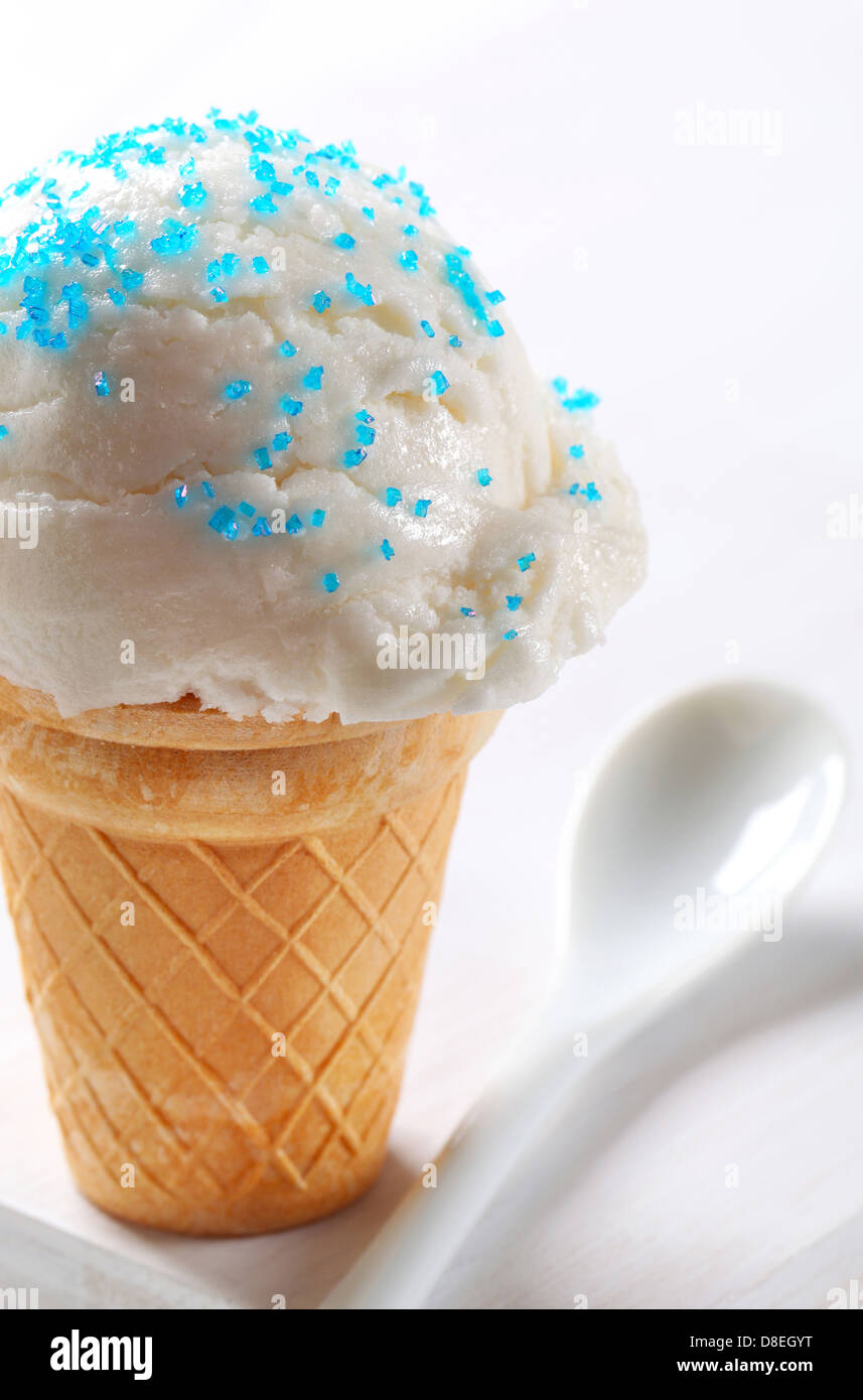 Lemon ice cream cone topped with sprinkles Stock Photo Alamy