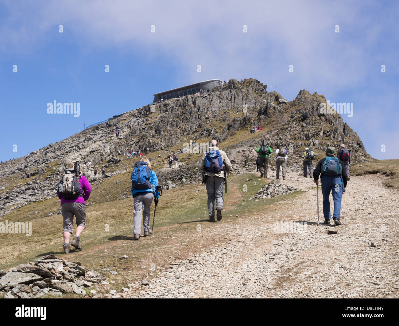 Hikers hiking on Rhyd Ddu path up to Mount Snowdon summit cafe (Hafod Eryri) in Snowdonia National Park North Wales UK Britain Stock Photo