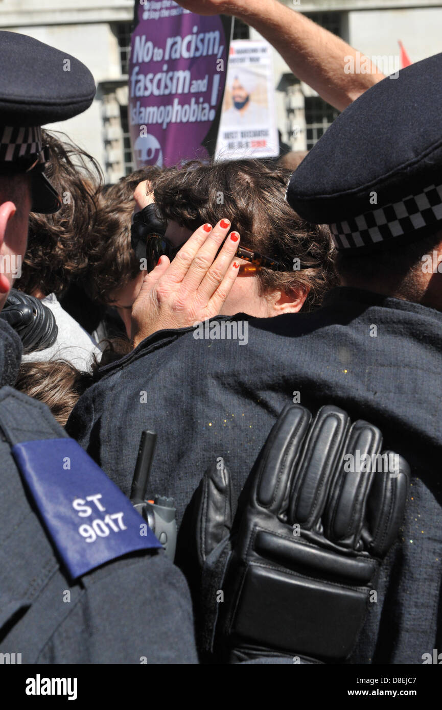 Whitehall, London, UK. 27th May 2013. There is much pushing and shoving as the police 'Hold the Line' at the counter deomonstration to the EDL. The EDL demonstration prompted by the death of Drummer Lee Rigby and a counter demonstration cause chaos on Whitehall as they move towards Downing Street. Stock Photo
