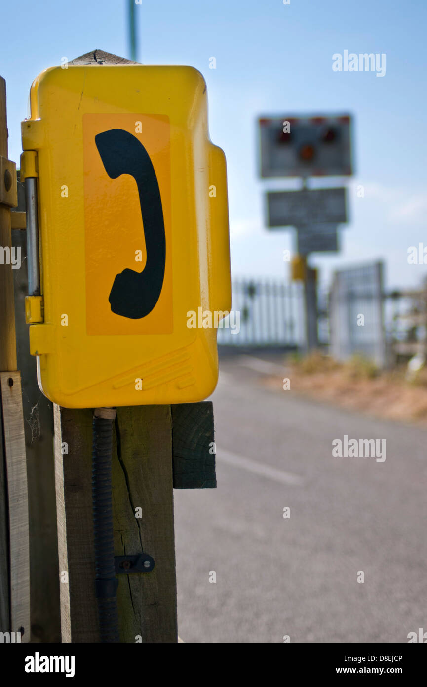 Emergency SOS telephone used by road users to contact signalman at a level crossing. Stock Photo