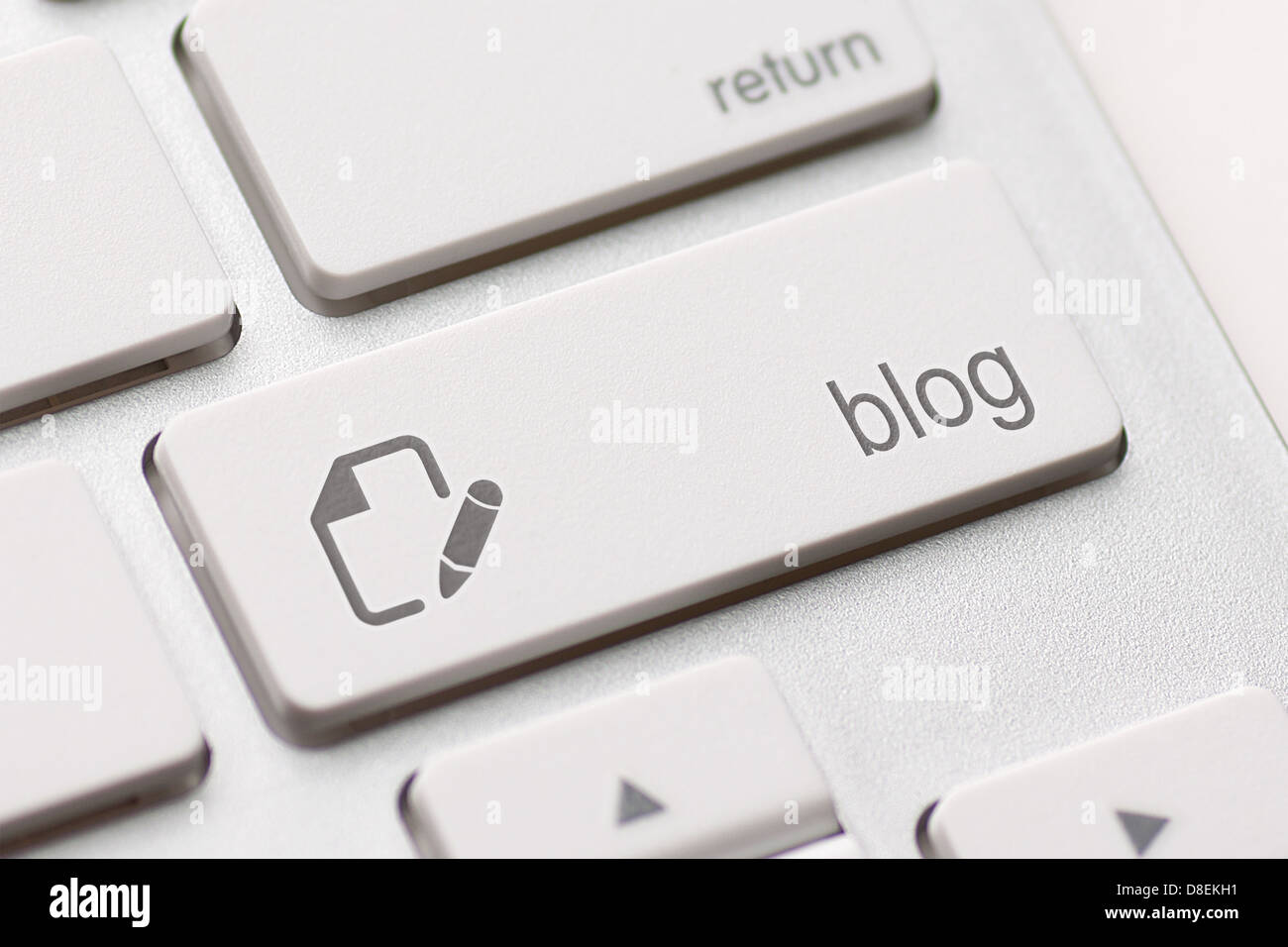 blog enter button key on white keyboard Stock Photo
