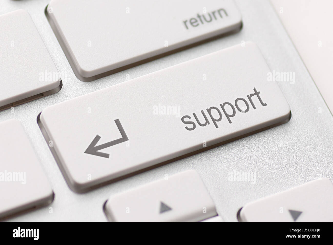 A computers support key on white keyboard Stock Photo