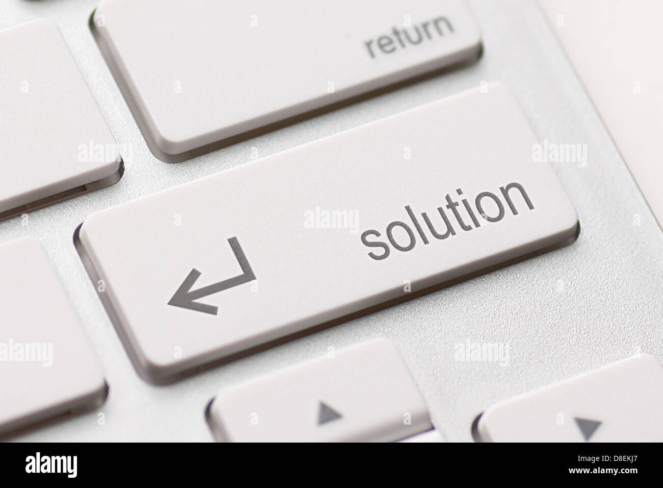 A computers solution key on white keyboard Stock Photo