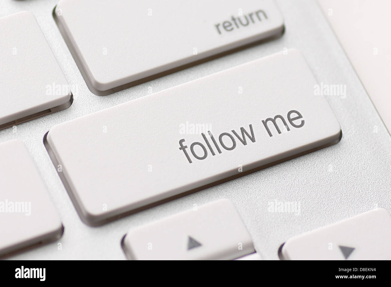 Follow Me button on the key of a computer keyboard Stock Photo