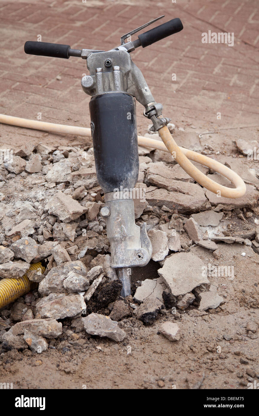 Jack-hammer in concrete. Stock Photo