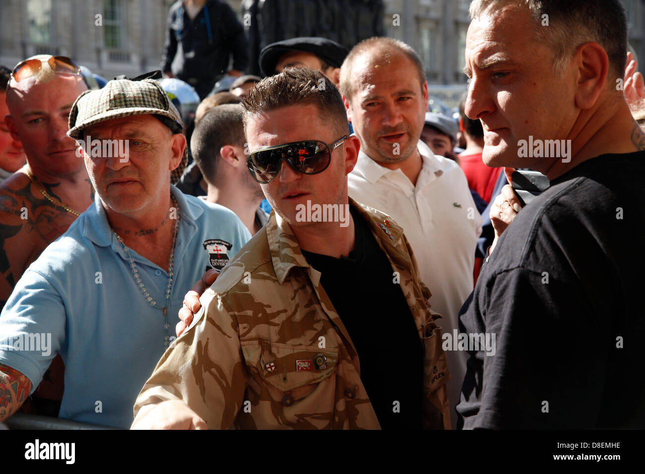 London, UK. 27th May, 2013. EDL marched to Downing street under strict police supervision while the UAF were holding a counter protest. Tommy Robinson in the middle while at the protest outside Downing Street. Credit: Lydia Pagoni/Alamy Live News Stock Photo