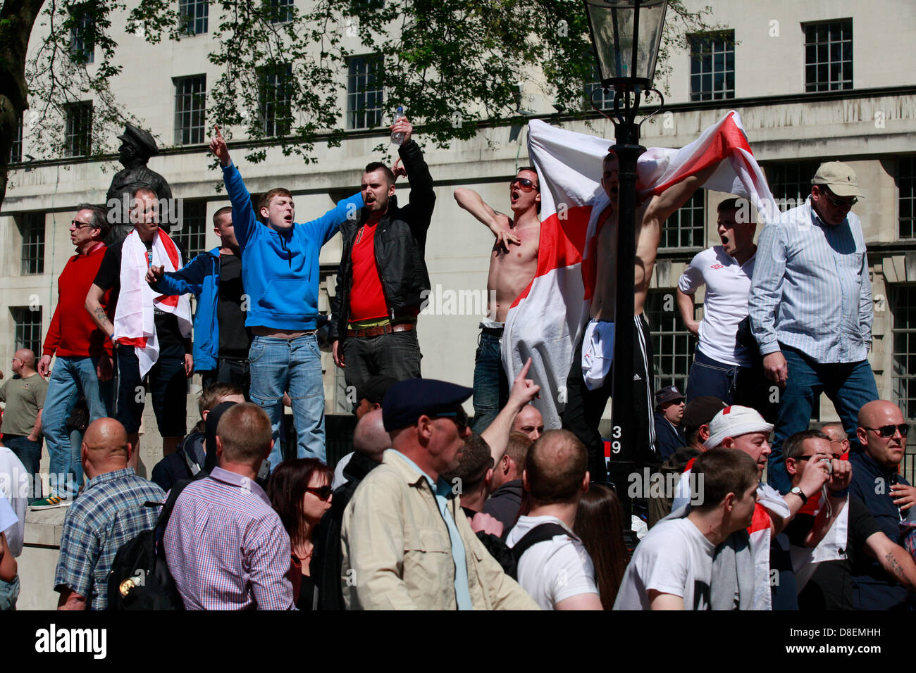 London, UK. 27th May, 2013. EDL marched to Downing street under strict police supervision while the UAF were holding a counter protest. EDL members outside downing street just across of the UAF people. Credit: Lydia Pagoni/Alamy Live News Stock Photo