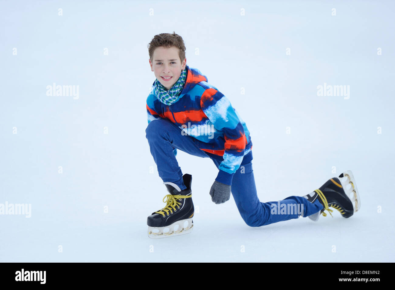 Boy iceskating on a frozen lake Stock Photo Alamy
