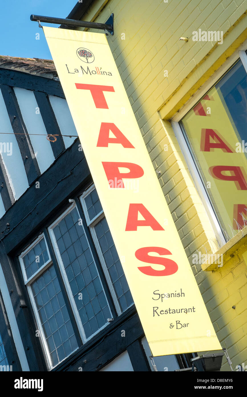 Looking Up At A Banner Advertising A Spanish Tapas Restaurant And