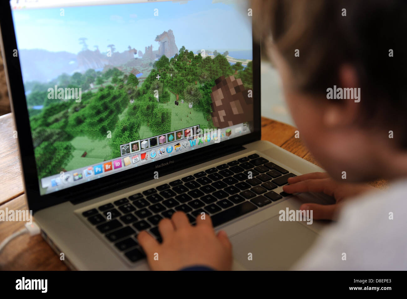 8 Year Old Boy Playing On Minecraft On An Apple Lmac Book Pro Laptop Computer Stock Photo Alamy